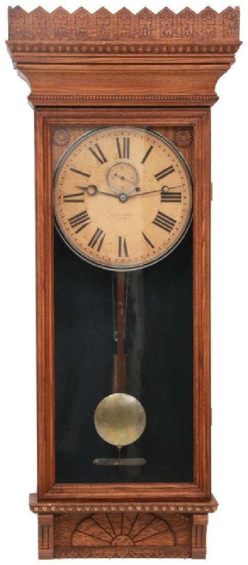 Gilbert No. 14 Oak Wall Regulator: Gilbert No. 14 Oak Wall Regulator. Original 12" paper dial signed "Wm. L. Gilbert Clock Co., Winsted, Conn." has black Roman hour numerals, inset sub seconds and blued open moon hands; brass 8 day wei