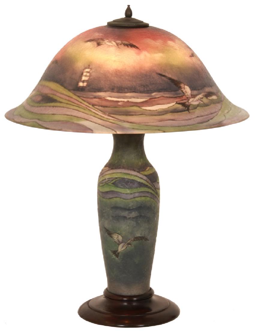Pairpoint 20 Inch Seagull Table Lamp: Pairpoint 20 Inch Seagull Table Lamp. Copley style shade, artist signed "F. Rae", shade is colorfully reverse painted with a shoreline scene with lighthouse and flying seagulls; on a matching glass ba