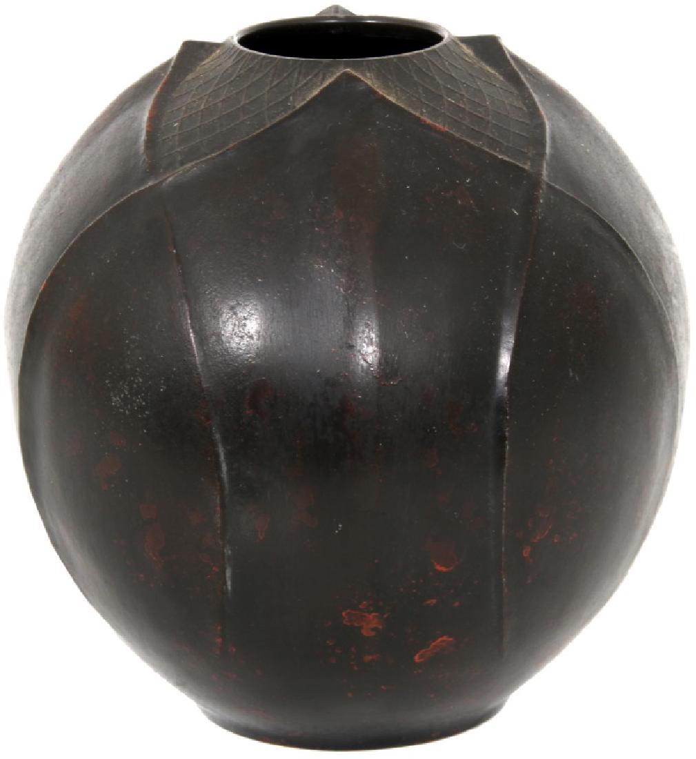 Asian Floriform Bronze Vase: Asian Floriform Bronze Vase. Overlapping repeating leaf pattern, leading to a fish net design toward the vase opening in the top. Excellent red-brown original patina. Dimensions: 6.5 in. high x 7 in. 