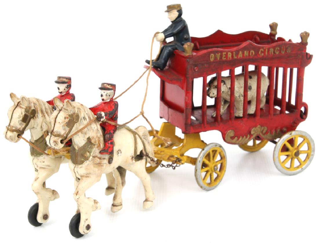 Kenton Cast Iron Overland Circus Toy Wagon: Kenton Cast Iron Overland Circus Toy Wagon with Bear. Horse drawn wagon with 2 horse riders, carriage driver and polar bear in the cage. Original paint, good general condition having some typical pain