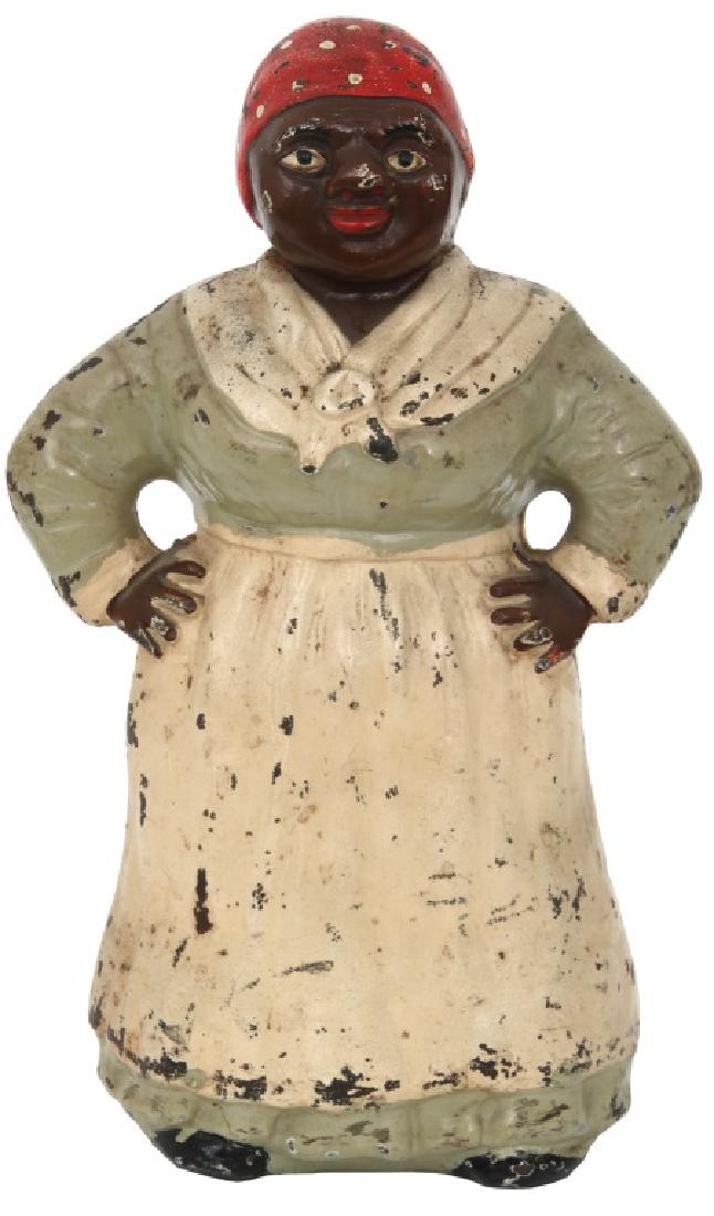 Hubley Aunt Gemima Doorstop: Hubley Aunt Gemima Doorstop. Large Hubley "Mammy" Cast Iron Doorstop. Large full figure of a black woman standing a in classic pose with hands on her hip. Original painted surface with various chips &