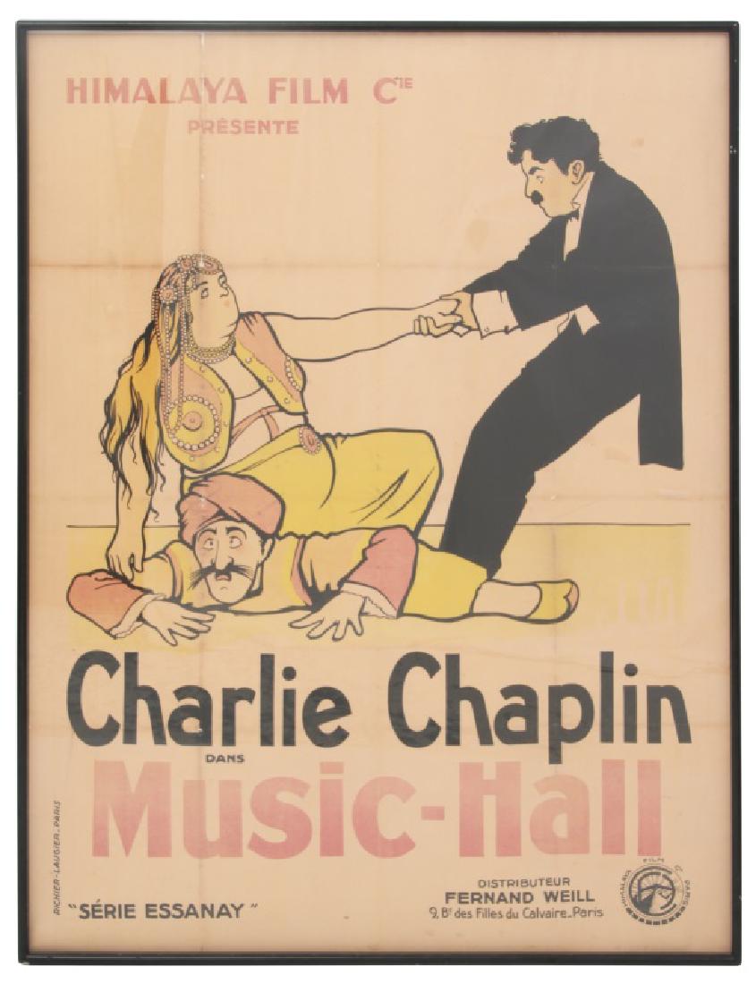 Vintage Charlie Chaplin Movie Poster: Vintage Charlie Chaplin Movie Poster. Large French movie poster with color lithograph scene of Charlie helping the sultan's wife off his back. Reads: 'Himalaya Film Cie. Presente, Charlie Chaplin dans