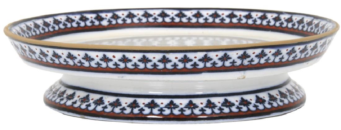 A. Pugin, Minton Low Form Tazza: A. Pugin, Minton Low Form Tazza. 10.5 in. diameter tray form with a low foot, designed by Augustus W. Pugin (1812-1852) for Minton, the plate has a Gothic period design with 8 point star in the center
