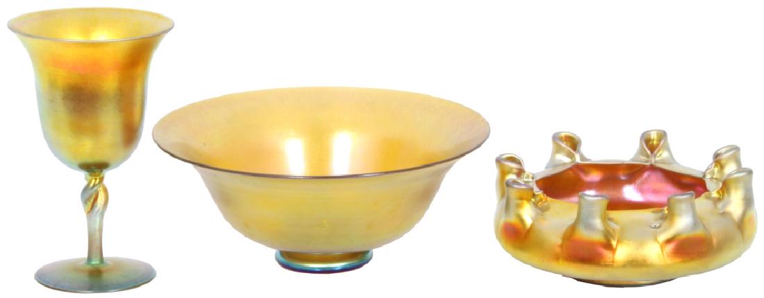 3 Pieces of Steuben Gold Aurene: 3 Pieces of Steuben Aurene 1.) Gold chalice with flaring rim & twisted applied base, signed Aurene 2361, 3¾ in. diameter, height: 6 in., 2.) Gold bowl with flaring rim on a short pedestal base, signe