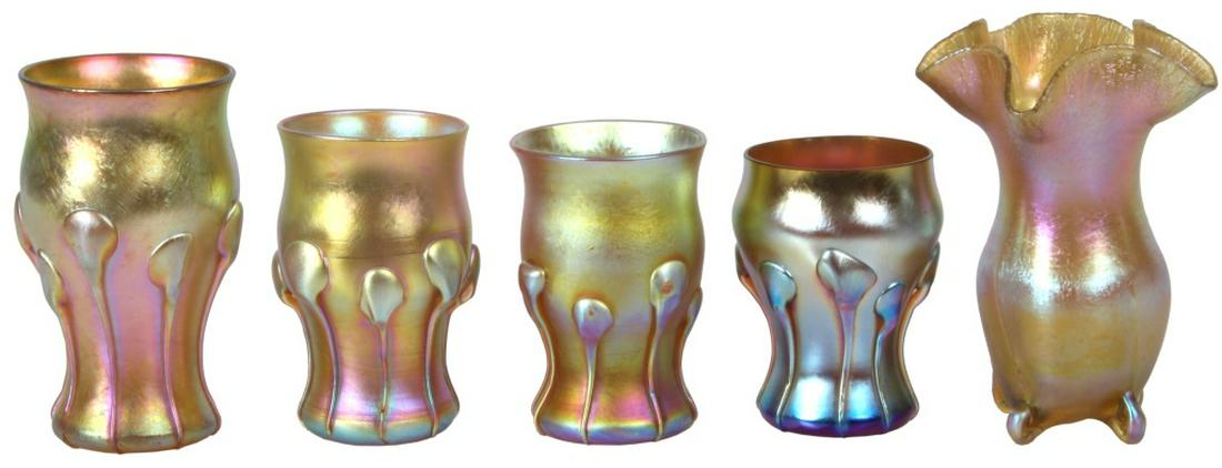 Five Tiffany Studios Cabinet Vases: Five Tiffany Studios Cabinet Vases. Gold iridescent footed cabinet vase has ruffled and crackled rim and is signed "L.C.T. W7653," 4 1/4 in. high. Four gold iridescent vases have small applied tendril