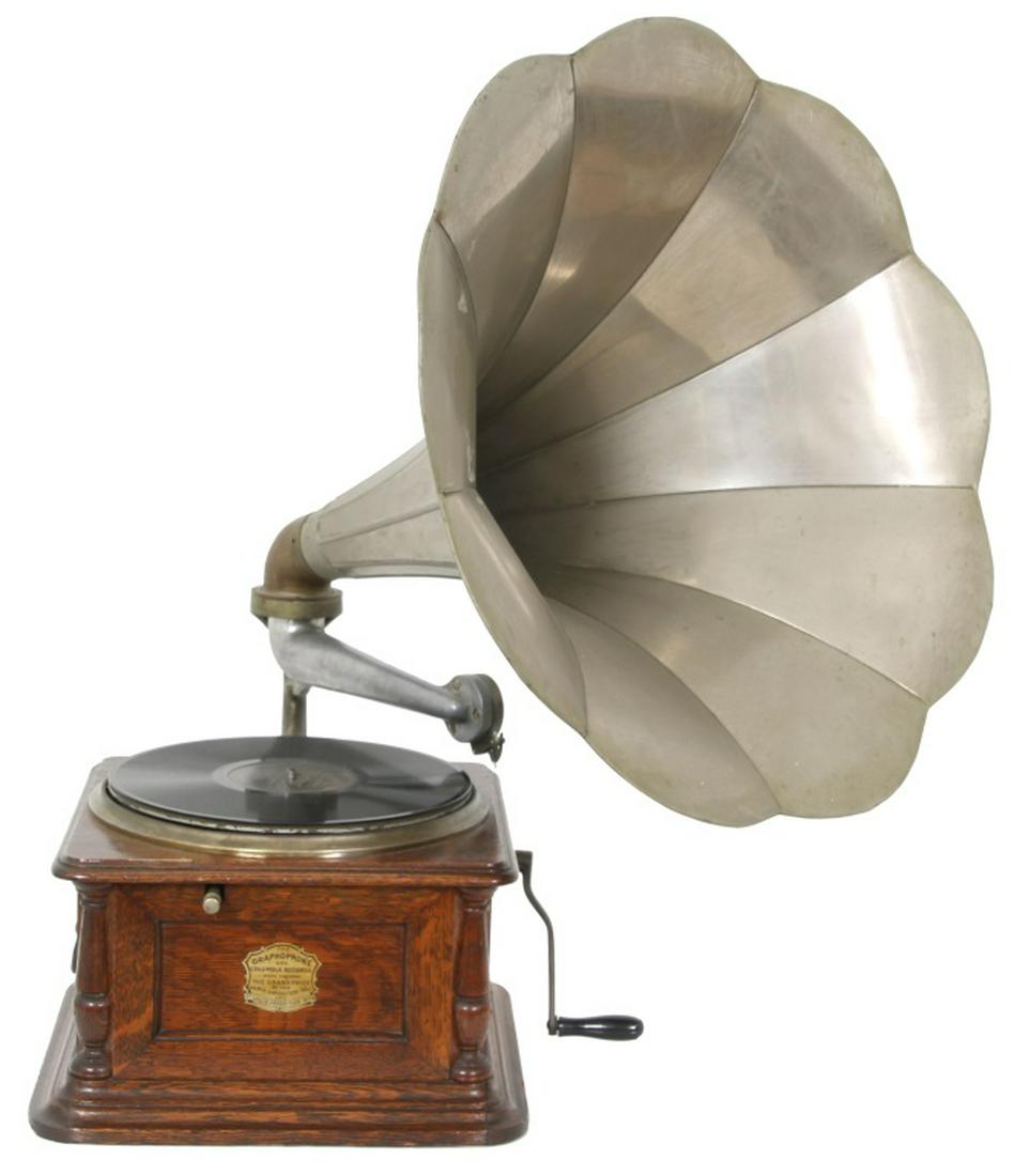 Columbia BI Disc Graphophone: Columbia BI Disc Graphophone. Oak case with turned corner columns, inset side panels and gold banner decals that read, "The Columbia Disk Graphophone, Columbia Phonograph Co., New York & London." Has 