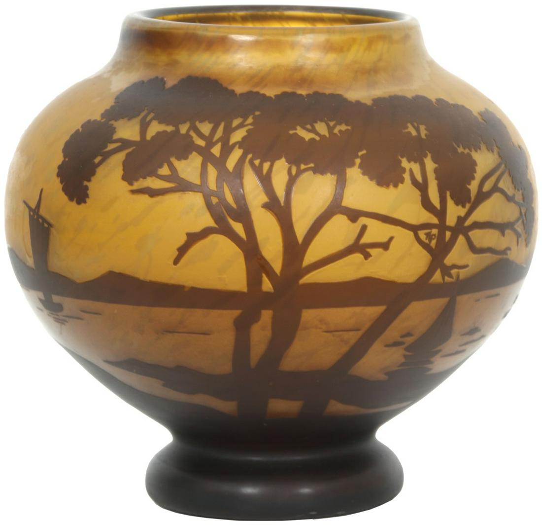 Daum Nancy Cameo Glass Vase: Daum Nancy Cameo Glass Vase. Cameo glass vase depicting a woodland lake scene with tall trees in the foreground and mountains and sailboats in the background; signed "Daum Nancy" in cameo. In good con