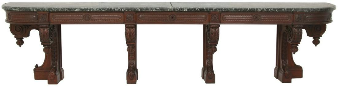 Massive Twelve Foot Carved Oak Console Table: The twelve foot long table has 6 heavy ornate leg supports, with acanthus carving, turned and carved finials with cartouche shields at the bottom. Five drawers in the apron with floral medallion carve