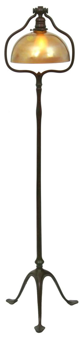 Tiffany Studios Harp Floor Lamp: Tiffany Studios Harp Floor Lamp. Bronze base stands on 3 serpentine legs with leafy pad feet, long stem with harp top, 2 1/4 in. diameter shade fitter and single pendant socket; has a dark brown patin