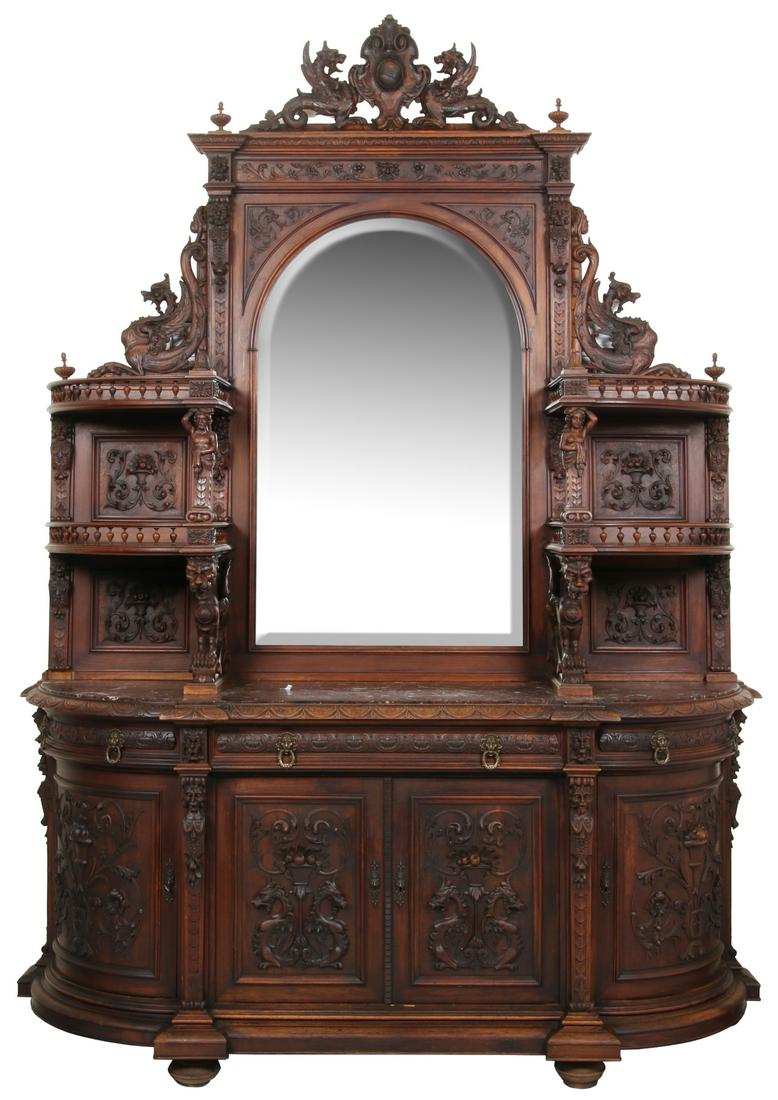 Large Griffin Carved Walnut M.T. Sideboard: Large Griffin Carved Walnut Marble Top Sideboard. The highly carved back rests on a marble top, has 4 curved shelves supported by winged griffins on the bottom and figures of a man and woman above, th