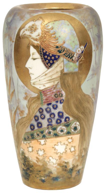 Amphora "Allegory of Germany" Portrait Vase: Amphora "Allegory of Germany" Portrait Vase. Art Nouveau style vase is decorated with a side profile of a woman having long brown hair and wearing an eagle head helmet, silhouetted with a golden halo;