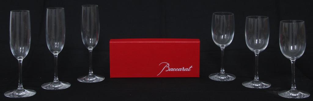 Group of 47 Baccarat Glasses: Group of 47 Baccarat Glasses. Included in this lot is 23 large wine glasses, 12 small wine glasses & 12 champagne flutes in original boxes and bags; two bags are ripped. Weight: 45.10 lbs.