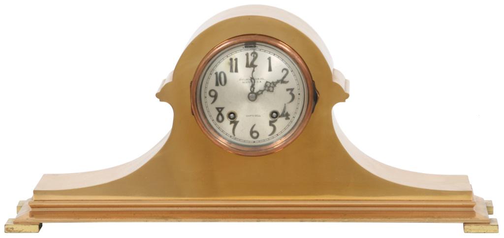 Chelsea "Tambour" Mantle Clock: Chelsea "Tambour" Mantle Clock. The 4 inch dial has a silvered finish with applied Arabic numerals, signed "Chelsea Clock Co., Boston U.S.A." & Ship's bell, in good condition. In a gold gilded "tambou