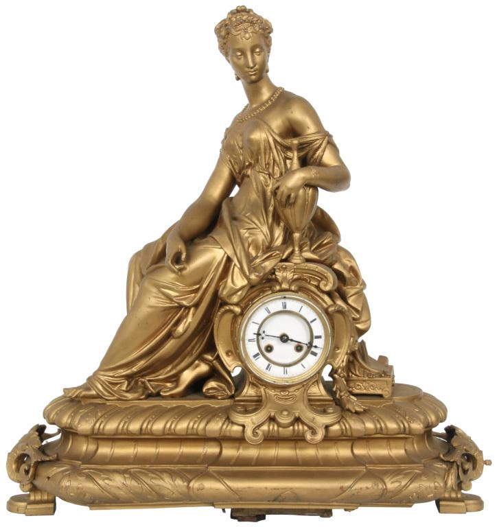 Large French Figural Spelter Clock: Large French Figural Spelter Clock. Figure of a seated woman in a casual robe leaning on an urn. Eight day movement strikes on a bell. Center leg support is missing, case repainted gold. Dimensions: 2