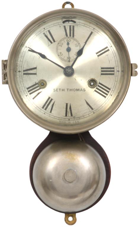Seth Thomas Ships Bell Clock: Seth Thomas Ships Bell Clock. The 5.5 inch silvered dial has incised Roman hour numerals, signed "Seth Thomas, Made in U.S.A." The case has an original nickel finish in good condition, mounted on an o
