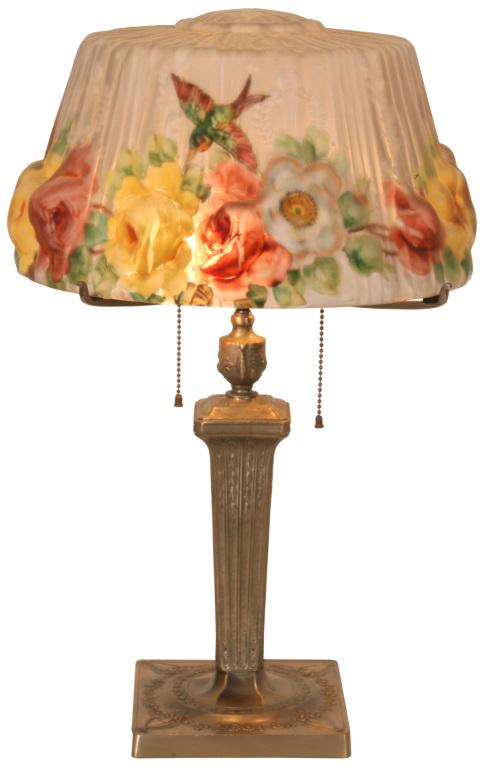 Pairpoint Puffy "Devonshire" Lamp with Hummingbird: Pairpoint puffy "Devonshire" shade has hummingbirds over a border of white, yellow & red roses connected by thorny branches, against a white background with wreath & torch accents. Signed Pairpoint ba