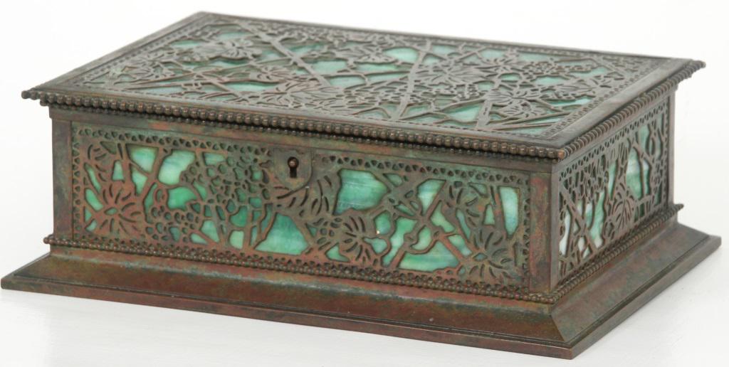Tiffany Studios Grapevine Humidor: Tiffany Studios humidor has a pierced grapevine pattern overlaid on panels of green and white striated glass, 3 rows of beads all around, hinged lid has locking mechanism (missing key). Medium red-bro