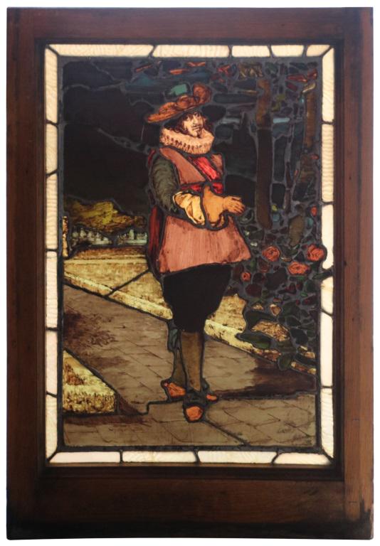 William McPherson Stained Glass Window: William McPherson stained glass window depicts a man wearing extravagant garments and a ruff, walking down a sidewalk with trees and flowers to his right; signed "W.J. McPherson, Boston" lower left. N
