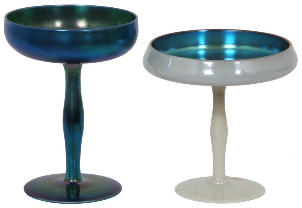 Two Steuben Iridescent Compotes: Two Steuben Iridescent Compotes. 1) Steuben blue Aurene glass compote has a round foot with turned stem; signed on the underside, "Aurene, 2642." 2) White iridescent "Calcite" exterior has a round foo