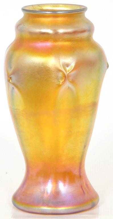 Tiffany Studios Favrile Glass Vase: Tiffany Studios Favrile glass gold iridescent vase is decorated with pinched motifs around the shoulder and flares out at the bottom; signed on the underside, "L.C.T. W960." In very good condition wit