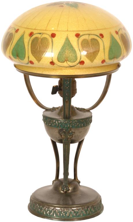 Pairpoint Arts & Crafts Table Lamp: Pairpoint lamp has a reverse painted dome shade with a lower border of alternating two toned green Arts & Crafts style leaves outlined in gold. The leaves repeat at the top center of the dome. On a si