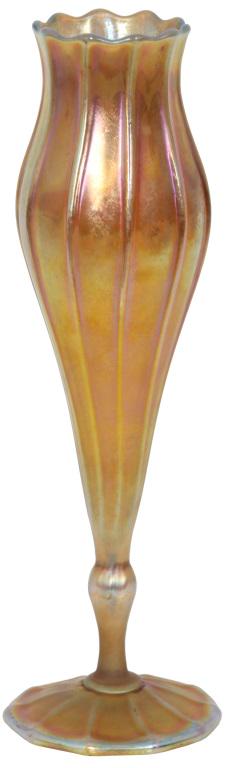 Tiffany Studios Favrile Glass Floriform Vase: Tiffany Studios gold iridescent art glass bud vase has a flowering form with long ribs that rise to the scalloped and flared rim; signed on the underside, "L. C. Tiffany - Favrile 1525 - 7977 L." Has 