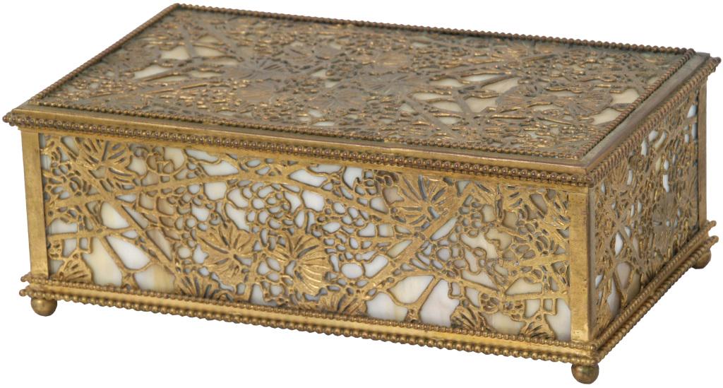 Large Tiffany Studios Grapevine Jewelry Box: Tiffany Studios jewelry box in the grapevine pattern with a gold dore finish on bun feet, 2 cracked panels. Dimensions: 4 in. high x 10.75 in. wide x 6.5 in. deep. Weight: 4.85 lbs.
