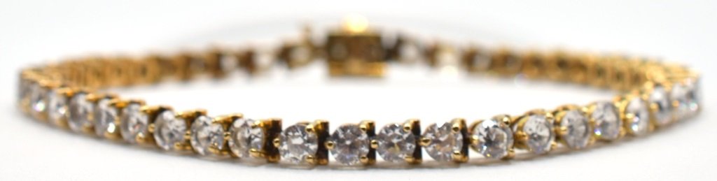 14K Yellow Gold & Diamond Tennis Bracelet: 14K yellow gold & diamond tennis bracelet includes 48 full cut K color diamonds that are each approximately 3.25 mm in diameter (averaged total). Diamonds weigh approximately 6 carats in total. Marked