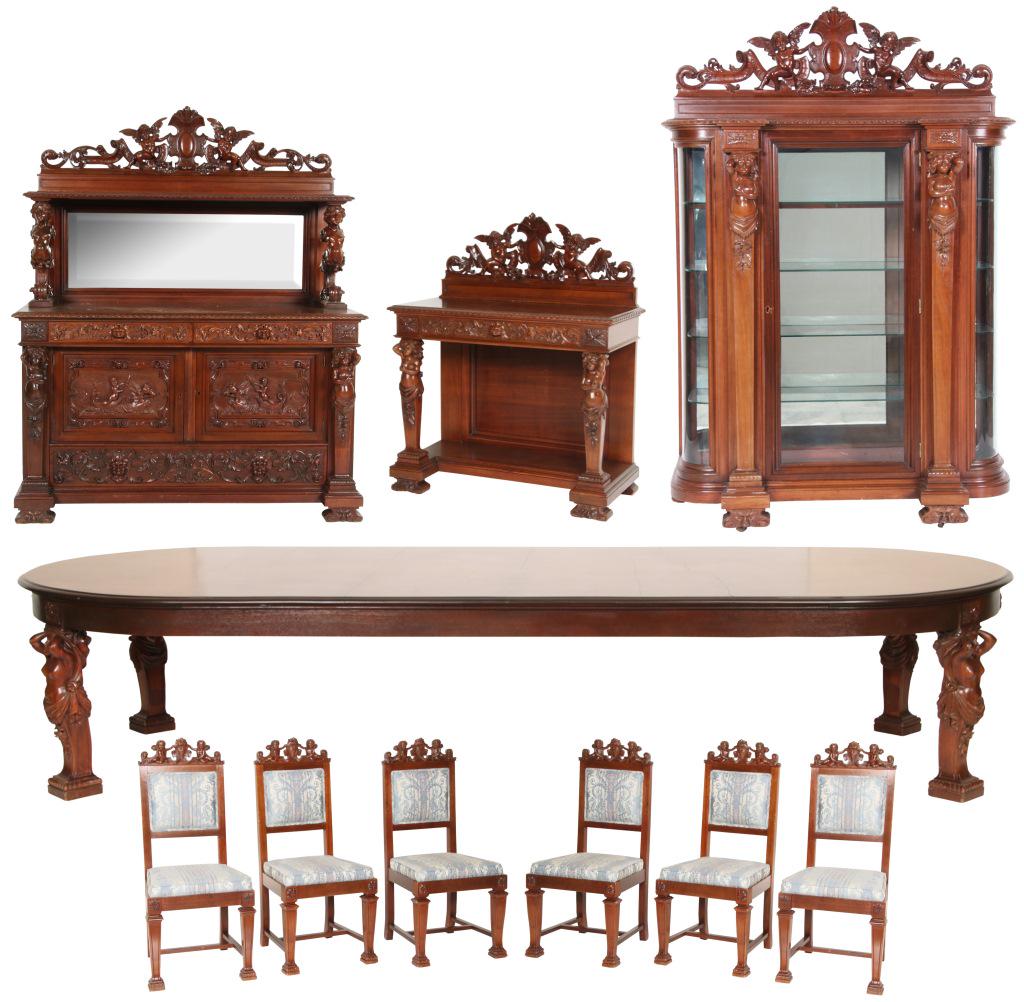 R.J. Horner 10 Piece Mahogany Dining Set: R.J. Horner 10 Piece figural carved mahogany dining room set has figural nude maiden bust pilasters, shelf supports and table legs. The sideboard with swirling filigree carved drawer fronts, carved pu