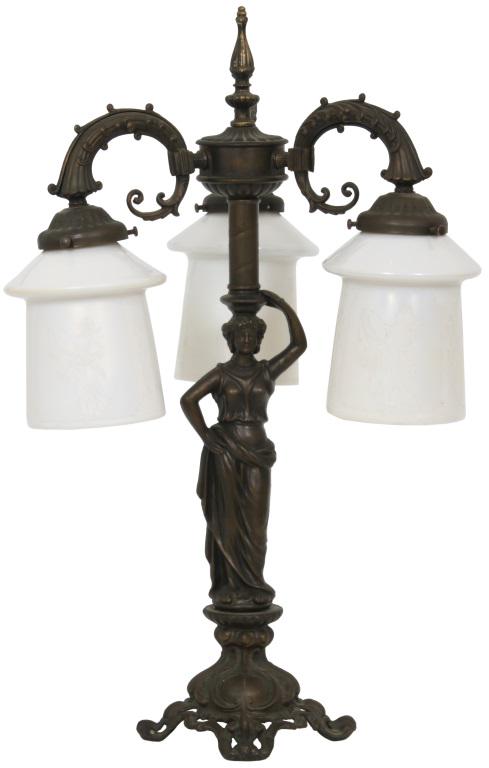 Three Light Figural Lamp with Steuben Shades: Three light lamp has a figural center post with a woman raising one arm with the other on her waist; above her are three cornucopia shaped arms holding the Steuben acid cutback calcite shades having f