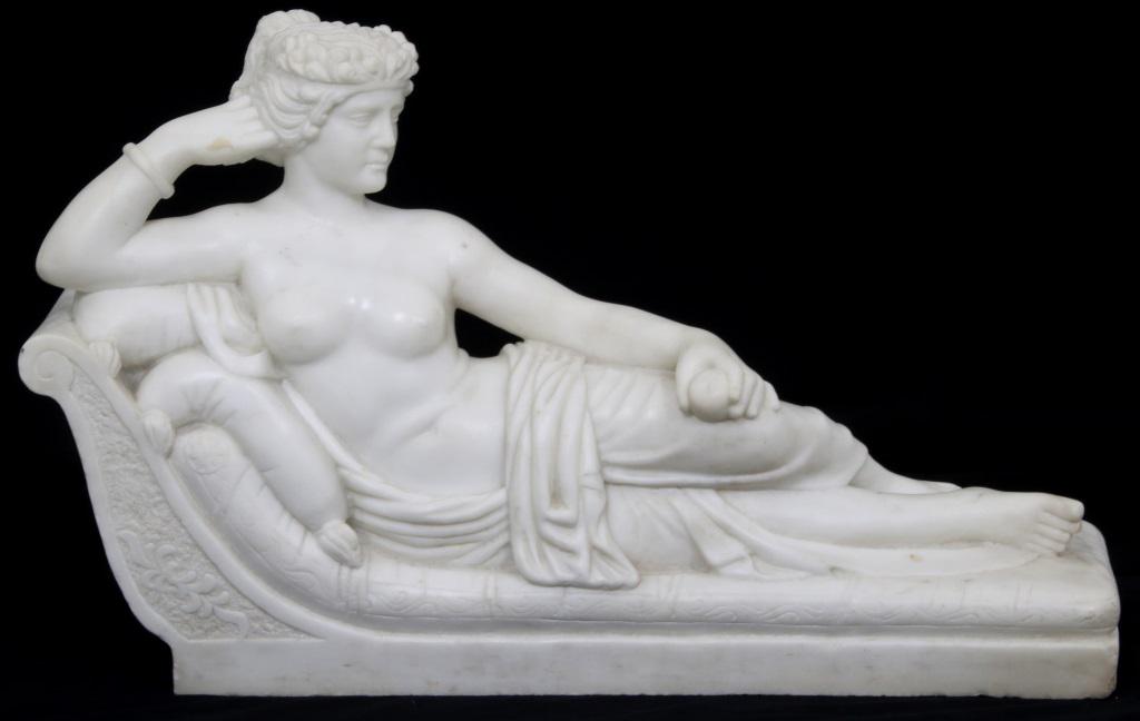 Marble Sculpture of Venus Victrix: The late 20th Century marble sculpture depicts a semi-nude Pauline Bonaparte as Venus Victrix with garments draped around her waist; she holds an apple in her left hand and is reclining on a recamier 