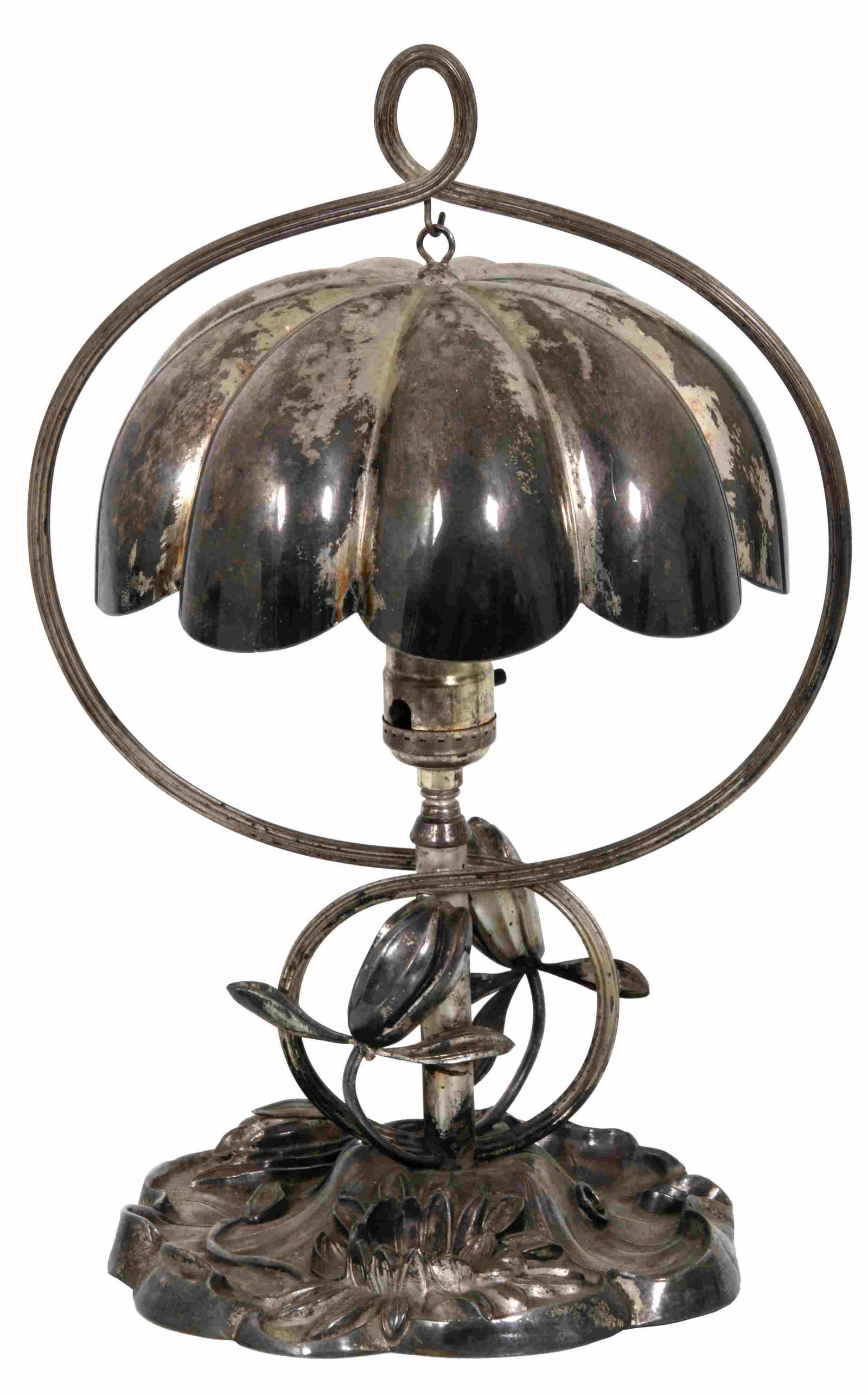Pairpoint Silver Plated Water Lily Desk Lamp: Pairpoint silver plated water lily desk lamp has a relief decorated base in the form of a lily pad with flower and buds extending upward, 2 long stems form a harp where the 8 in. diameter lobed 9 pane