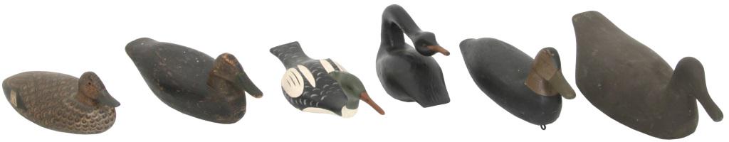 Five Duck Decoys & Goose: Five wooden duck decoys & a goose. All appear to be in original paint & two have glass eyes. Dimensions: largest; 7.5 in. high x 17 in. wide x 7 in. deep.