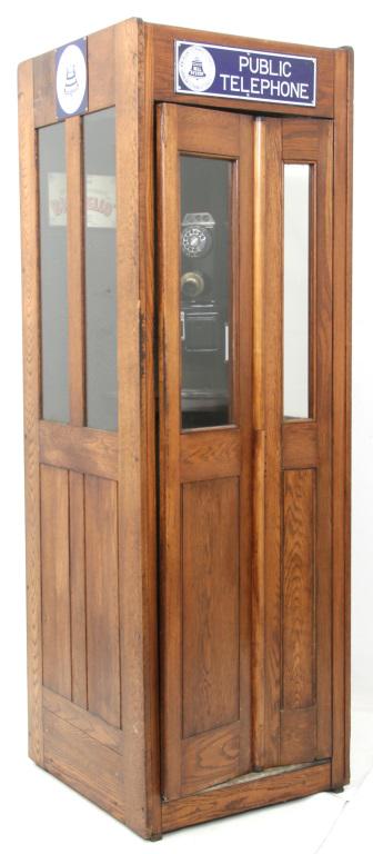 Oak Paneled Phone Booth: Oak phone booth with folding door. Paneled on all sides with glass panels on the top half of the door & sides. Manufactured by Turner-Armour Corporation, Brooklyn NY. Complete with porcelain Bell Syst