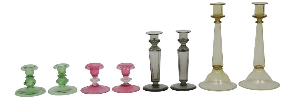 Four Pairs of Steuben Candlesticks: Steuben Glass Works Group of eight candlesticks, including four pairs clear and colored glass second and last pair signed "Steuben," third pair signed with fleur-de-lis mark early 20th century 3 1/2 i