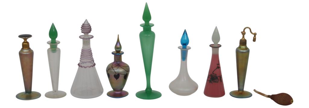 Group of 8 Perfumes & Atomizer: Group of eight iridescent and colored glass items, majority Steuben, include seven perfume bottles and one atomizer, first signed "DeVilbiss," second signed with Steuben fleur-de-lis mark, seventh sig