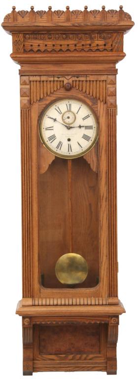 Gilbert No. 11 Wall Hanging Clock: William L. Gilbert Clock Company No. 11 wall hanging clock with eight-day, weight driven, time only movement oak case, glass sides dial signed "Wm. L. Gilbert Clock Co., Winsted, Conn." circa 1891