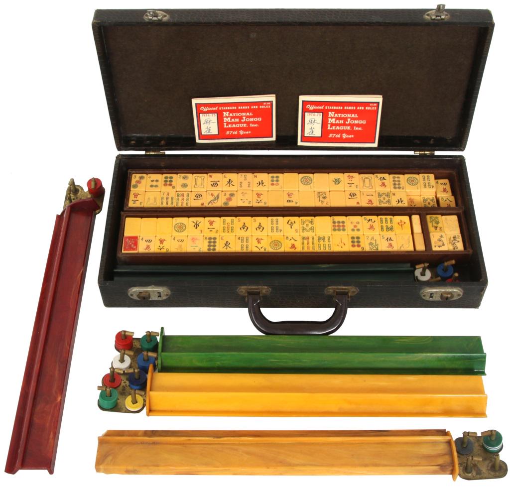 Mah Jongg Game in Case: National Mah Jongg League, Inc. game set in case with official standard hands and rules, 1974-75. 3 3/4 in. high x 19 1/2 in. wide x 9 in. deep