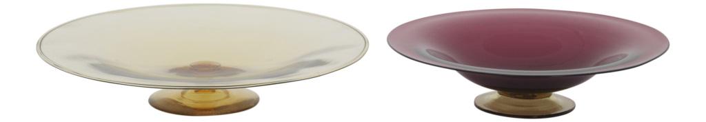 Two Steuben Glass Compotes: Steuben Glass Works Two footed compotes in a low form colored glass unsigned early 20th century 2 1/4 in high x 12 in. diameter (1) 2 1/2 in. high x 10 in. diameter (2)