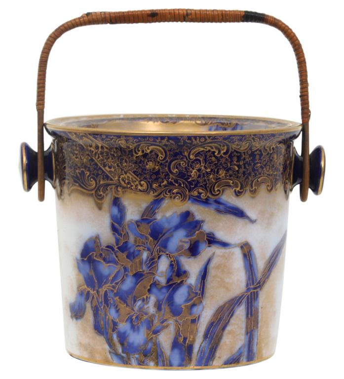 Doulton Burslem Flow Blue Slop Jar: Doulton Burslem Flow blue slop jar decorated with filigree and a floral motif earthenware marked "Doulton Burslem, England" circa 1890 15 in. high x 13 1/2 in. wide x 11 in. deep
