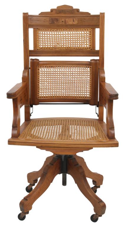 Eastlake Walnut Office Chair: Eastlake walnut office chair with adjustable supports, incised decoration, caned back & seat with burled walnut panels, late 19th century. 41 1/2 in. high x 21 in. wide x 19 in. deep