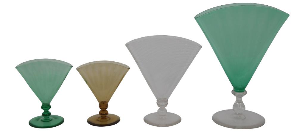 Group of Four Steuben Fan Vases: Steuben Glass Works Group of four fan vases with ribbed bodies colored and clear glass unsigned early 20th century 5 3/4 in. high x 5 in. wide x 3 1/4 in. diameter (small) 11 1/4 in. high x 8 3/4 in. 