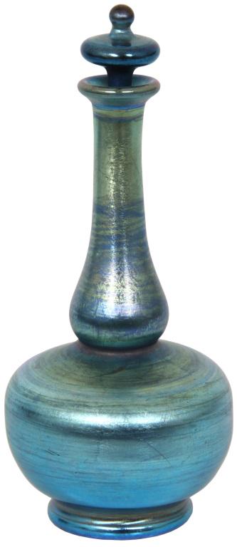 Tiffany Studios Favrile Glass Perfume Bottle: Tiffany Studios Favrile glass perfume bottle in a bulbous form has blue iridescence and is complete with the original stopper. Signed on the underside, "X396" and has the Tiffany Glass and Decorating