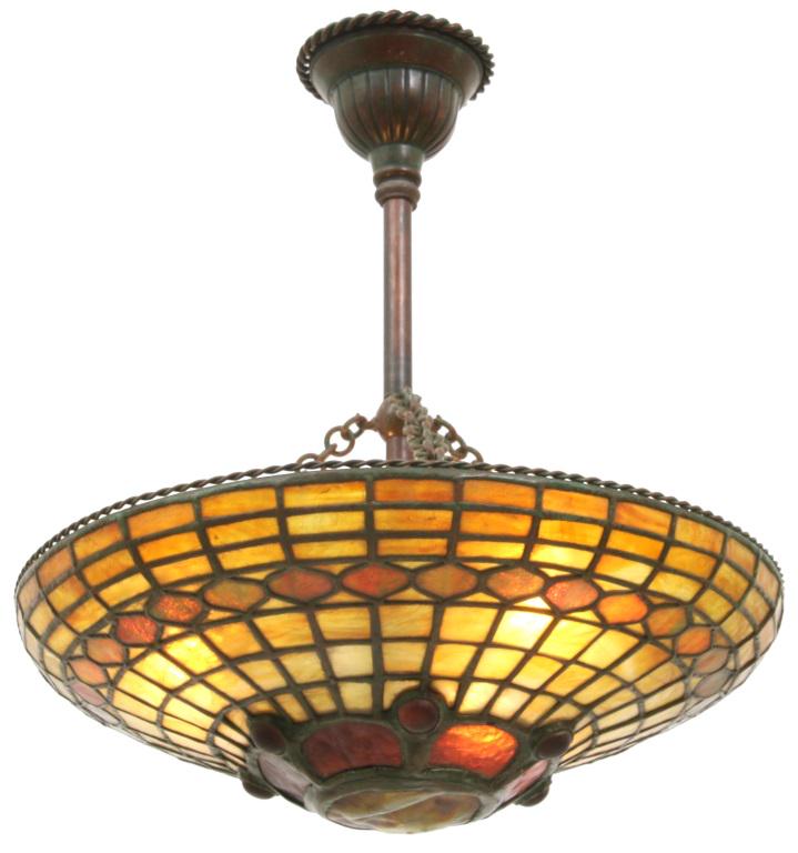 Tiffany Studios Turtleback Chandelier: Tiffany Studios chandelier has a 19-inch diameter leaded glass shade with a deep red-amber diamond pattern band and geometric panels above and below. Centered at the bottom is a single turtleback tile