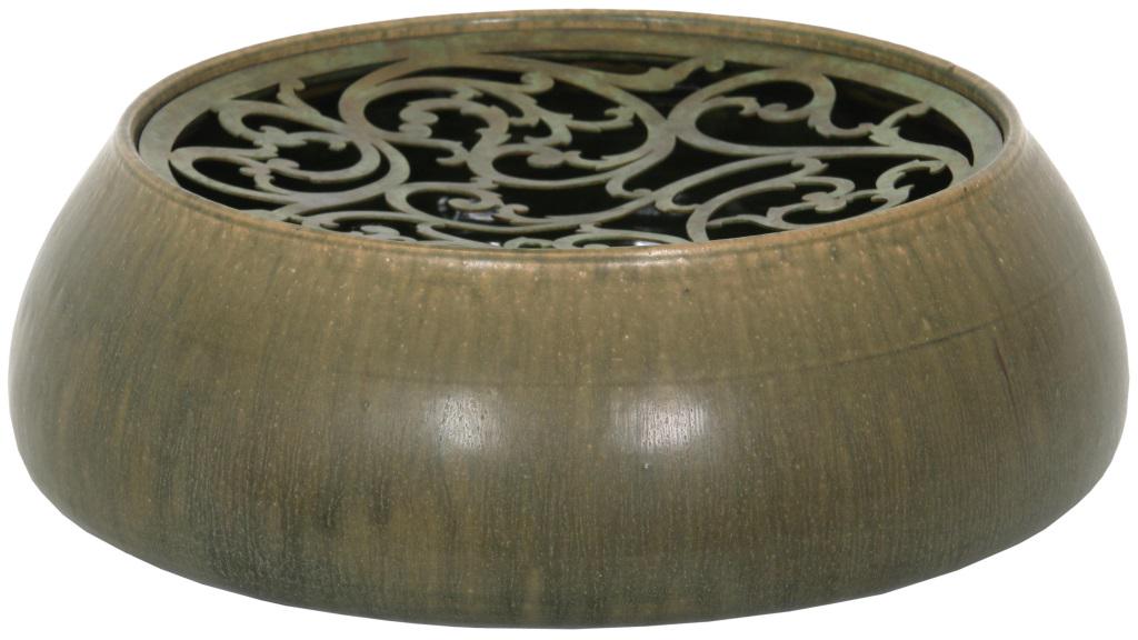 Tiffany Studios Pottery Fernery: Tiffany Studios pottery fernery has a low form with an earth tone colored exterior and green interior. The brass reticulated cover is filigree decorated and is signed "Tiffany & Co. 18632 Makers 1174 