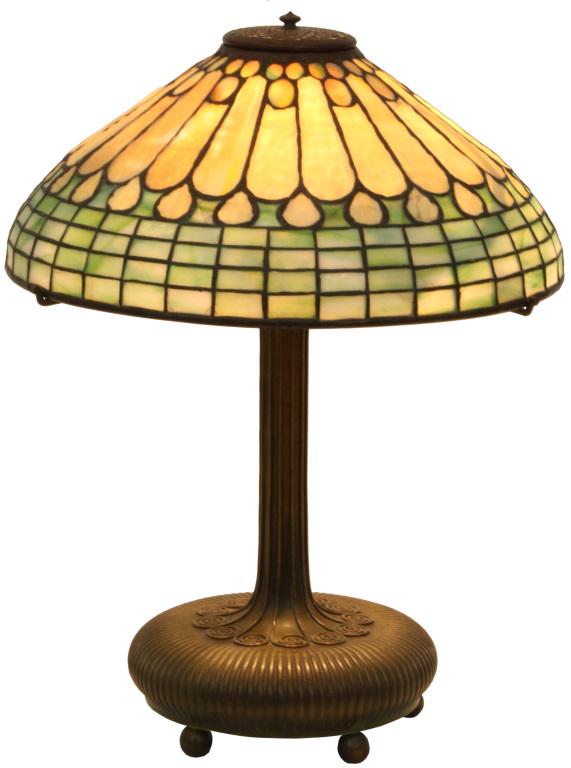 Tiffany Studios Jeweled Feather Table Lamp: Tiffany Studios table lamp has a 16-inch diameter leaded glass jeweled feather designed shade with four rows of geometric panels below heavily textured feather panels; signed on the inside rim, "Tiffa