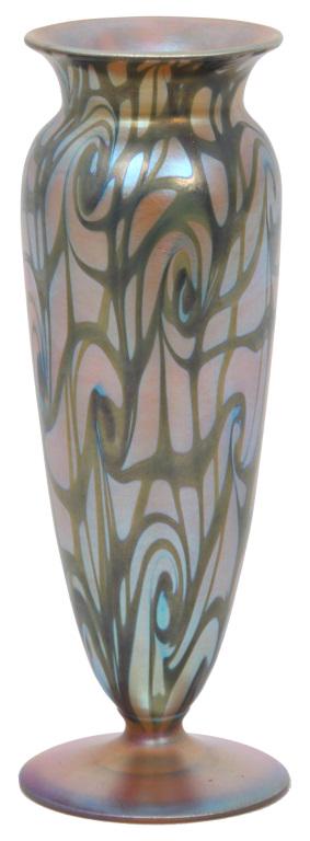 Durand King Tut Art Glass Vase: Durand art glass vase is decorated in a green iridescent "King Tut" pattern set against a gold iridescent background. The vase is in a baluster form having a flaring rim with gold iridescent interior