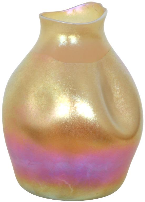 Tiffany Studios Favrile Glass Vase: Tiffany Studios Favrile glass vase in an organic form with strong gold iridescence that ends on a jagged line towards the top. The bottom portion of the vase has desirable purple highlights. Signed on