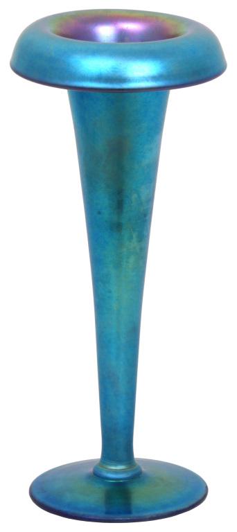 Steuben Blue Aurene Vase: Steuben blue Aurene vase has a trumpeted form with an inverted rim and is supported by a round foot. Signed on the underside, "Aurene 1124." Very good condition with no damage or repair. 8 in. high x 