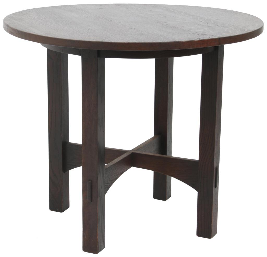 Gustav Stickley No. 648 Round Table: Gustav Stickley no. 648 table has a round top supported by a round skirt connecting the four legs and cross-stretcher base with through-tenon construction; refinished condition, unsigned. 30 in. high 